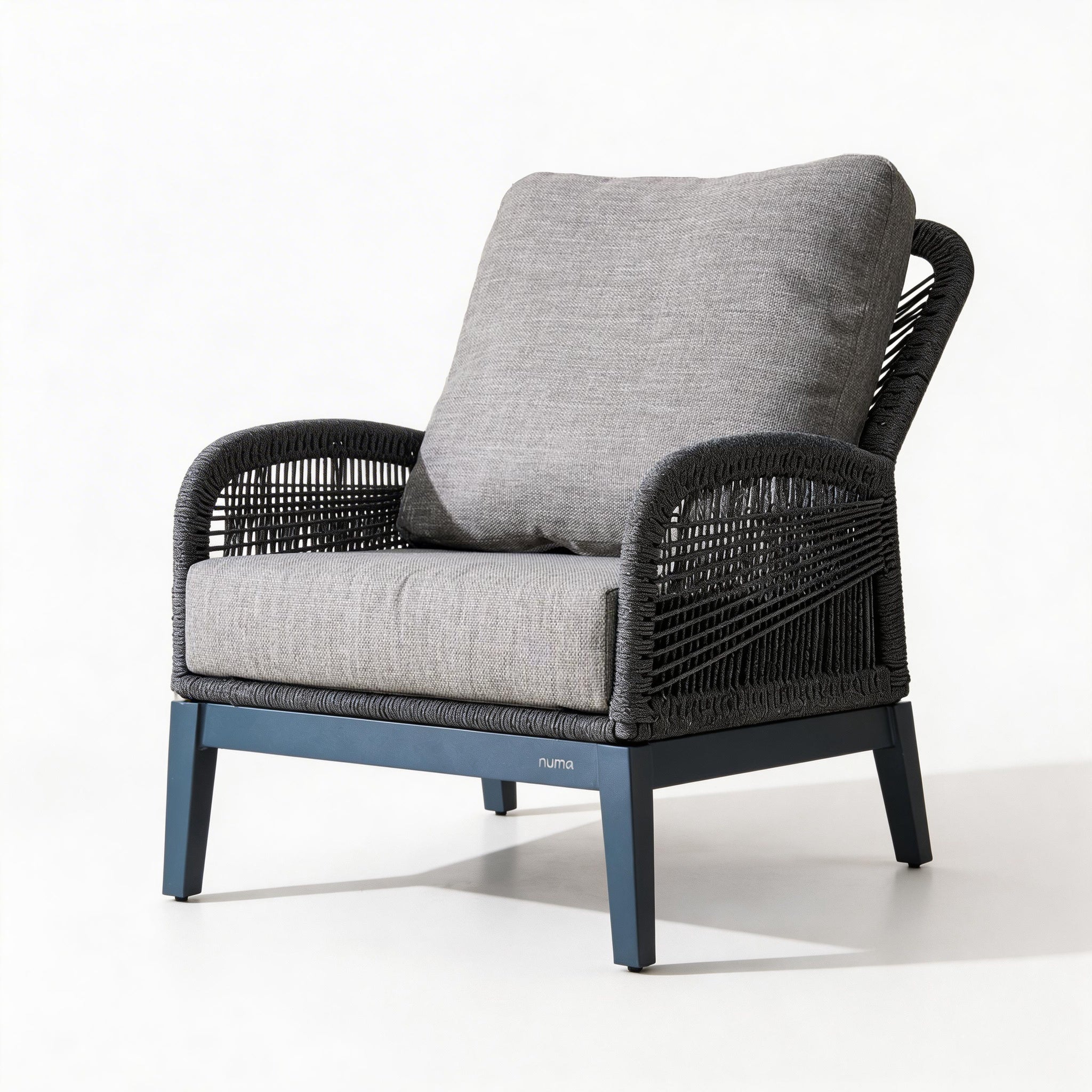 Chair with gray cushion and black woven frame on a white background